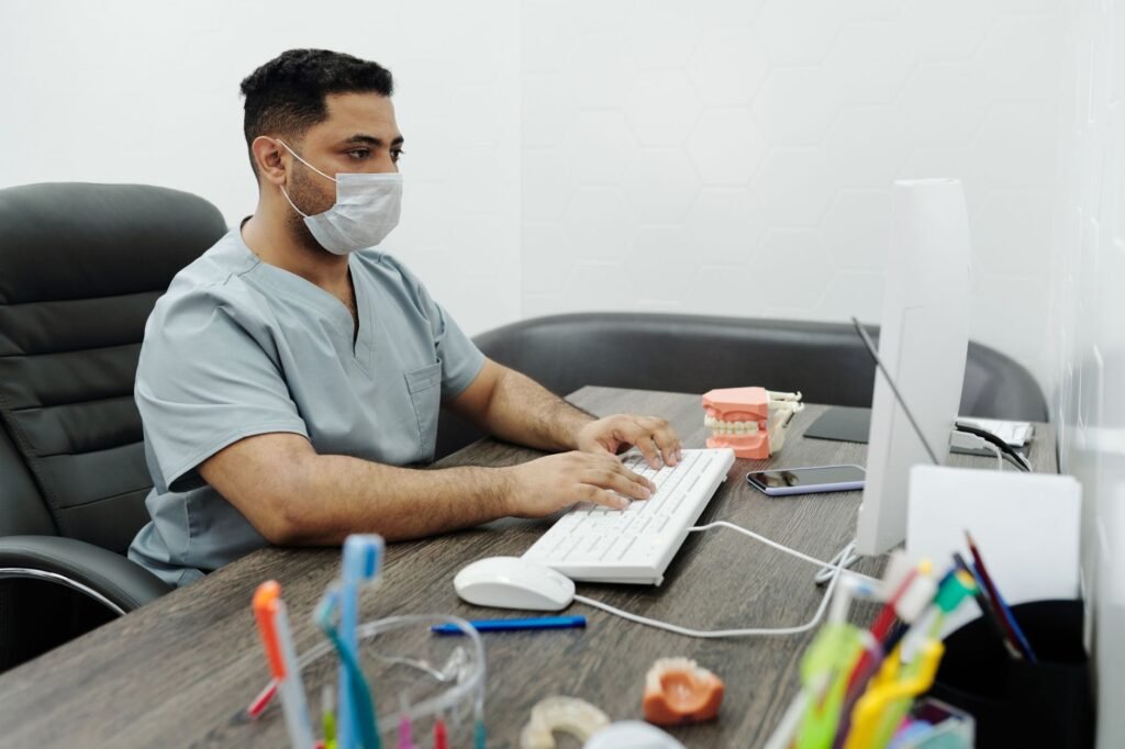 Dental billing team reviewing CDT and ICD-10-CM claim documentation in a dental office